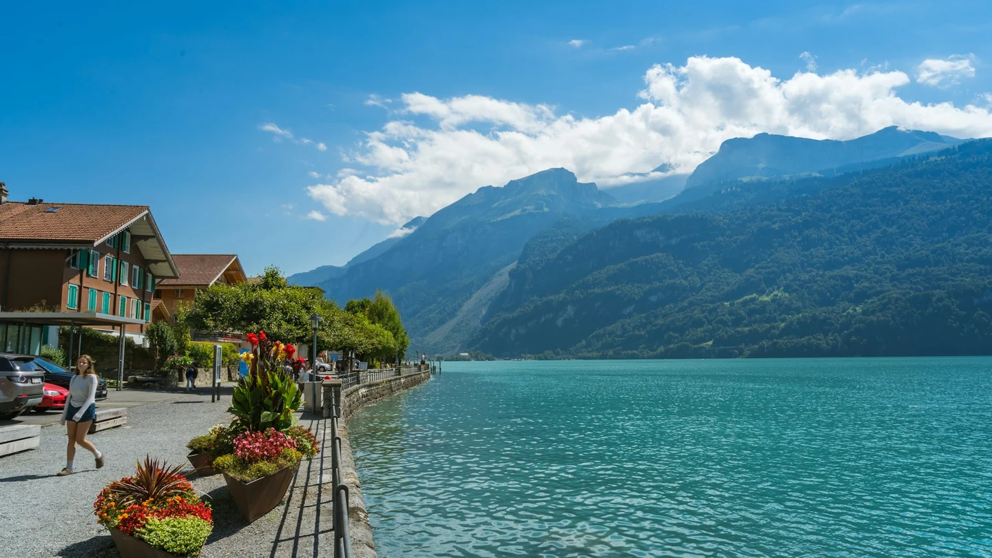 Lakeside promenade, flowers and turquoise water in Brienz
